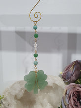 Load image into Gallery viewer, "FOUR-LEAF CLOVER BLESSINGS" Aventurine Crystal Carving Gold Stone Crystal Energy Enhancer© / Hanger / Ornament / Suncatcher

GOOD FORTUNE | HOPE | MAGIC | PROTECTION

A four-leaf clover Symbolises good luck and abundance. It is believed if you hold a four-leaf clover you will gain the ability to see fairies and leprechauns and find their treasures.&nbsp;

Beautiful Aventurine four-leaf clover crystal carving beaded with Amazonite, Aventurine and Quartz. Wire wrapped in Gold
