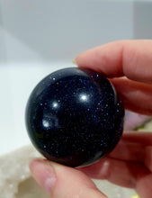 Load image into Gallery viewer, Sparkly Blue Sandstone Sphere Crystal Carving on Silver Stand. Inspires Concentration and Courage. Gorgeous
