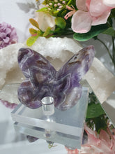 Load image into Gallery viewer, Butterfly Amethyst Crystal Carving Stone on Stand. Inspires Intuition and Spirituality.

Beautiful polished Amethyst Chevron Butterfly Crystal Carving on plastic stand
