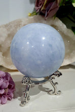 Load image into Gallery viewer, Celestite Sphere Crystal Carving on Silver Stand. Inspires Communication with the Angels
