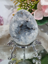 Load image into Gallery viewer, Celestite Egg Crystal Carving on silver Stand.

Inspires Communication with the Angels

Gorgeous Celestite egg Crystal Carving on silver Stand.
