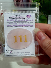 Load image into Gallery viewer, manifest your dreams and desires. Crystal rose quartz Crystal Carving affirmation button. Hold and voice what you desire. 111 indicates the universe to opening up a path for change and reaching your dreams. 
