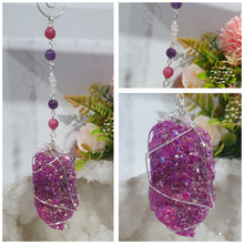 Load image into Gallery viewer, ENCHANTED AURA - Handcrafted Titanium Aura Quartz Crystal Energy Enhancer© / Hanger / Ornament / Suncatcher 

inspires EMPOWERMENT | COMPASSION | MAGICK

Gorgeous Titanium Aura Quartz crystal beaded with Rhodochrosite, Amethyst and Rose Quartz. Wire wrapped in silver

Genuine Crystals. no plastic or glass. Ensuring energy flow throughout the enhancer. Crystal Suncatchers
