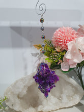 Load image into Gallery viewer, ENCHANTED AURA - Handcrafted Titanium Aura Quartz Crystal Energy Enhancer© / Hanger / Ornament / Suncatchers

EMPOWERMENT | PROTECTION | MAGICK

Gorgeous handcrafted Titanium Aura Quartz crystal beaded with Rainbow Hematite and Hematite. Wire wrapped in silver

Genuine Crystals. no plastic or glass. Ensuring energy flow throughout the enhancer.
