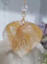 Load image into Gallery viewer, This stunning Ultimate Healer Crystal Energy Enhancer Suncatcher is handcrafted and created with a stunning Golden Healer heart and beaded with golden healer and quartz. Hang in your home or space and feel the ambient energy. Inspires Power and connection. See our other Crystal Suncatchers
