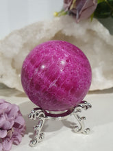 Load image into Gallery viewer, Ruby Sphere Crystal Carving on Silver Stand.  Inspires Attraction and Sensuality. Sphere is a little darker than pics show
