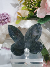 Load image into Gallery viewer, Butterfly Moss Agate Crystal Carving Stone on Stand. Inspires tranquility and grounding.

Beautiful polished Moss Agate Butterfly Crystal Carving on plastic stand
