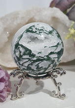 Load image into Gallery viewer, Lovely Moss Agate Sphere Crystal carving on silver stand.  Beautiful Druzy! Great Crystal Gift Idea. Promotes Grounding and connection to earth 
