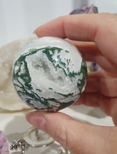 Load image into Gallery viewer, Lovely Moss Agate Sphere Crystal carving on silver stand.  Beautiful Druzy! Great Crystal Gift Idea. Promotes Grounding and connection to earth 
