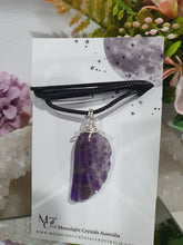 Load image into Gallery viewer, "WING OF AN ANGEL" Amethyst Angel Wing Crystal Stone Pendant wire wrapped Silver .

Inspires Divine Connection and Intuition.

Angel Wings symbolise love, protection, purity and freedom. Connections to the Angels and divine realm.

Beautiful handcrafted Amethyst Angel Wing Crystal Carving Pendant in silver non tarnish wire. Comes with a cord necklace.
