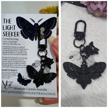 Load image into Gallery viewer, "THE LIGHTSEEKER" Metal Moth Keyring Key chain with Quartz Beads Stone Crystal Key Ring 

INSPIRES GUIDANCE AND TRANSFORMATION

Carry a little Light wherever life takes you!

Gorgeous black coloured metal Moth Keyring Key ring with rose charm, beaded with Quartz.


