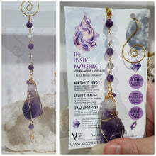 Load image into Gallery viewer, THE MYSTIC AWAKENING" Handcrafted Amethyst Raw Crystal Stone Gold Crystal Energy Enhancer© Hanger Ornament Suncatcher

INSPIRES INTUITION, WISDOM AND SPIRITUALITY

Stunning Raw Amethyst crystal stone beaded with Amethyst and Quartz. Wire wrapped in gold.
