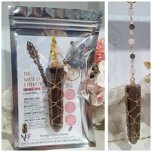 Load image into Gallery viewer, WAND OF STRENGTH" Handcrafted Smoky Quartz Tower Point Stone Gold Crystal Energy Enhancer© Hanger Ornament Suncatcher 

Inspires GROUNDING | LOVE | STABILITY

Gorgeous Smoky Quartz crystal tower beaded with Smoky Quartz, Rose Quartz and Herkimer Diamond.  Wire wrapped in gold
