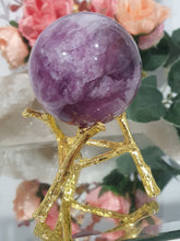 Load image into Gallery viewer, Purple Fluorite Sphere Crystal Carving Stone on Gold Branch shaped stand.
