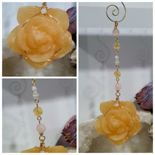 Load image into Gallery viewer, Stunning "ROSE OF SUNSHINE" Handcrafted Orange Calcite Rose Carving gold Crystal Energy Enhancer© Hanger Ornament Suncatcher. hang in your room or space. Inspires Joy, cleansing and love
