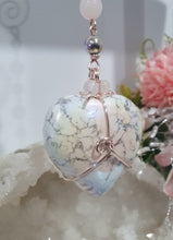 Load image into Gallery viewer, HEART OF A UNICORN" Aura Howlite Heart Stone Rose Gold Crystal Energy Enhancer© Hanger Ornament Suncatcher

INSPIRES MAGICK AND LOVE

Gorgeous Aura Howlite Heart beaded with Rose Quartz, Rainbow Hematite and Quartz. Wired in Rose Gold
