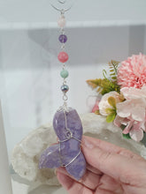 Load image into Gallery viewer, "MERMAID TALES" Lavender Jade Mermaid Tail silver Crystal Energy Enhancer© Hanger Ornament Suncatcher.
Inspires Enchantment, Freedom and Balance. 
Gorgeous Lavender Jade Mermaid Tail Crystal Carving beaded with Amethyst, Rose Quartz, Rhodochrosite, Amazonite, Rainbow Hematite and Quartz. Wire wrapped in silver

