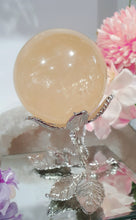 Load image into Gallery viewer, Honey Calcite Sphere Crystal Carving Stone on Silver Stem stand

INSPIRES SELF WORTH AND CONFIDENCE

lovely Honey Calcite sphere on silver stem stand
