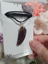 Load image into Gallery viewer, "WING OF AN ANGEL" Amethyst Angel Wing Crystal Stone Pendant wire wrapped Silver .

Inspires Divine Connection and Intuition.

Angel Wings symbolise love, protection, purity and freedom. Connections to the Angels and divine realm.

Beautiful handcrafted Amethyst Angel Wing Crystal Carving Pendant in silver non tarnish wire. Comes with a cord necklace.

