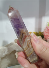 Load image into Gallery viewer, Lovely Amethyst Agate Tower. stunning tower just has a slight lean and the tip has paint or something on it. doesnt look like stone.  think it might have paint on or part of the tip protection. apart from this the colouring is gorgeous. 
