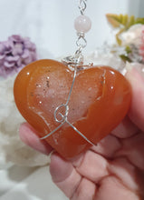 Load image into Gallery viewer, HEART OF LOVE &amp; SEDUCTION" -  - Carnelian Heart Silver Wired Stone Crystal Energy Enhancer© Hanger Suncatcher Ornament 200mm | Inspires Sensuality, Love &amp; Stability

INSPIRES SENSUALITY | LOVE | STABILITY 

Carnelian heart Crystal Energy Enhancer© / Hanger / Ornament beaded with Carnelian, Rose Quartz, Hematite, Herkimer Diamonds and quartz.  wired in silver
