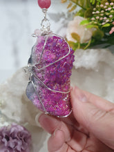 Load image into Gallery viewer, ENCHANTED AURA - Handcrafted Titanium Aura Quartz Crystal Energy Enhancer© / Hanger / Ornament / Suncatcher 

inspires EMPOWERMENT | COMPASSION | MAGICK

Gorgeous Titanium Aura Quartz crystal beaded with Rhodochrosite, Amethyst and Rose Quartz. Wire wrapped in silver

Genuine Crystals. no plastic or glass. Ensuring energy flow throughout the enhancer. Crystal Suncatchers
