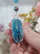 Load image into Gallery viewer, HEART OF THE OCEAN" Handcrafted Titanium Aura Sphalerite Heart Crystal Carving Silver Crystal Energy Enhancer© / Hanger / Ornament / Suncatcher

Inspires PSYCHIC FLOW | LOVE | INTUITION

Gorgeous Titanium Aura Sphalerite heart crystal carving stone beaded with Aquamarine, Rainbow Hematite &amp; Quartz.  Wire wrapped in silver
