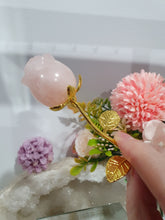 Load image into Gallery viewer, Rose Flower Rose Quartz Crystal Carving with gold stem.

Promotes Unconditional Love and Harmony

Beautiful Rose Quartz Flower / Rose Crystal Carving with gold stem and leaves.
