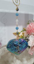 Load image into Gallery viewer, HEART OF THE OCEAN" Handcrafted Titanium Aura Sphalerite Heart Stone Crystal Carving Gold Crystal Energy Enhancer© / Hanger / Ornament / Suncatcher

Inspires PSYCHIC FLOW | LOVE | INTUITION

Gorgeous Titanium Aura Sphalerite heart crystal carving beaded with Aquamarine, Rainbow Hematite &amp; Quartz.  Wire wrapped in gold
