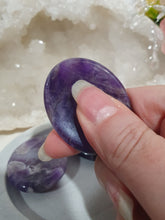 Load image into Gallery viewer, "Worry Stone" Amethyst Crystal Carving Stone.

INSPIRES INTUITION AND SPIRITUALITY

What is a worry Stone? Perfectly shaped for your thumb, this crystal worry stone connects you to positive energy. Rubbing its smooth surface allows it to act as a powerful vessel for emotional release from anxiety and stress.

Lovely Amethyst crystal worry stone crystal carving.  Pop in your bag and keep with you to alleviate stress. Intuitively ( Randomly) chosen.

