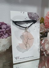 Load image into Gallery viewer, Rose Quartz Moon Crystal Pendant Wire Wrapped Silver Stone with black cord chain

INSPIRES UNCONDITIONAL LOVE &amp; HARMONY

Beautiful Rose Quartz Moon Crystal Carving Wire Wrapper in Silver non tarnish wire. Accompanied by a black cord necklace



