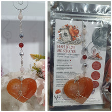 Load image into Gallery viewer, HEART OF LOVE &amp; SEDUCTION" -  - Carnelian Heart Silver Wired Stone Crystal Energy Enhancer© Hanger Suncatcher Ornament 200mm | Inspires Sensuality, Love &amp; Stability

INSPIRES SENSUALITY | LOVE | STABILITY 

Carnelian heart Crystal Energy Enhancer© / Hanger / Ornament beaded with Carnelian, Rose Quartz, Hematite, Herkimer Diamonds and quartz.  wired in silver
