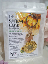 Load image into Gallery viewer, THE SUNFLOWER KEEPER" Metal Sunflower with Sunstone Beads Crystal Keyring.

Choose from Gold of Silver medal colour.

INSPIRES JOY | HOPE | OPTIMISM

Carry a little Sunshine wherever life takes you!

 "The sunflower has long symbolised joy, hope and unwavering optimism. Like the flower that turns towards the sun, it reminds us to keep looking for the light, even through life's difficult seasons".

Gorgeous Metal sunflower Keyring Key ring beaded with AAA sunstone faceted beads.

