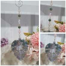 Load image into Gallery viewer, LEAF OF RENEWAL - Handcrafted Moss Agate Leaf silver Crystal Energy Enhancer© / Hanger / Ornament / Suncatcher 

SPIRITUAL GROWTH | LOVE | BALANCE

Gorgeous Moss Agate leaf crystal carving beaded with Rose Quartz &amp; Moss Agate. Wire wrapped in silver

Genuine Crystals. no plastic or glass. Ensuring energy flow throughout the enhancer. 


