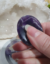 Load image into Gallery viewer, Worry Stone" Amethyst Crystal Carving Stone.

INSPIRES INTUITION AND SPIRITUALITY

What is a worry Stone? Perfectly shaped for your thumb, this crystal worry stone connects you to positive energy. Rubbing its smooth surface allows it to act as a powerful vessel for emotional release from anxiety and stress.

Lovely Amethyst crystal worry stone crystal carving.  Pop in your bag and keep with you to alleviate stress. Intuitively ( Randomly) chosen.

