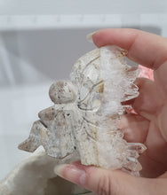 Load image into Gallery viewer, Fairy Quartz Cluster Crystal Carving Stone . Discounted as she is slightly bent 

Inspires Magick, Purity &amp; Spirituality

Stunning Quartz Crystal cluster fairy with gorgeous quartz crystal teeth. She is discounted as slightly bent at top
