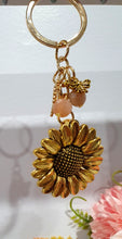 Load image into Gallery viewer, THE SUNFLOWER KEEPER" Metal Sunflower with Sunstone Beads Crystal Keyring.

Choose from Gold of Silver medal colour.

INSPIRES JOY | HOPE | OPTIMISM

Carry a little Sunshine wherever life takes you!

 "The sunflower has long symbolised joy, hope and unwavering optimism. Like the flower that turns towards the sun, it reminds us to keep looking for the light, even through life's difficult seasons".

Gorgeous Metal sunflower Keyring Key ring beaded with AAA sunstone faceted beads.

