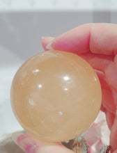Load image into Gallery viewer, Honey Calcite Sphere Crystal Carving Stone on Silver Stem stand

INSPIRES SELF WORTH AND CONFIDENCE

lovely Honey Calcite sphere on silver stem stand
