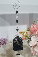 Load image into Gallery viewer, LIGHT THROUGH DARKNESS" Handcrafted Black Agate Tower Crystal Carving Silver Crystal Energy Enhancer© Gemstone / Hanger / Suncatcher / Ornament 

STRENGTH | COURAGE | CLARITY

Beautiful Black Agate Tower Carving Crystal Energy Enhancer© / Sun Catcher / Ornament / Hanger beaded with Black Agate, Quartz and Herkimer Diamonds.  wired in Silver

Can also be hung on your christmas tree. Christmas tree ornament decoration. 
