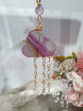Load image into Gallery viewer, Lovely "EVERY CLOUD HAS A SILVER LINING" Fluorite Cloud gold wired Crystal Energy Enhancer© Hanger Ornament Suncatcher.

From Darkness comes Light. 

TRANSFORMATION / INTUITION / SPIRITUALITY

Beautiful Fluorite Cloud Crystal Carving beaded with Fluorite &amp; Quartz.  wired in Gold
