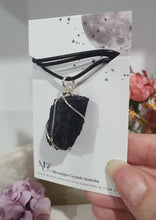 Load image into Gallery viewer, Gorgeous Black Tourmaline crystal stone wire wrapped in silver with black cord. Black Tourmaline promotes protective energy. 
