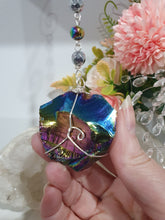 Load image into Gallery viewer, COSMIC ARMOUR - Handcrafted Rainbow Obsidian Stone Crystal Energy Enhancer© / Hanger / Ornament / Suncatcher 

INSPIRES PROTECTION AND GROUNDING

Gorgeous Rainbow Obsidian raw crystal stone beaded with Rainbow Hematite and Hematite. Wire wrapped in silver
