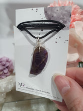 Load image into Gallery viewer, "WING OF AN ANGEL" Amethyst Angel Wing Crystal Stone Pendant wire wrapped Silver .

Inspires Divine Connection and Intuition.

Angel Wings symbolise love, protection, purity and freedom. Connections to the Angels and divine realm.

Beautiful handcrafted Amethyst Angel Wing Crystal Carving Pendant in silver non tarnish wire. Comes with a cord necklace.
