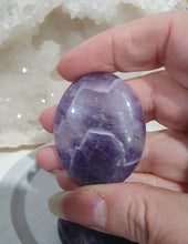 Load image into Gallery viewer, Worry Stone" Amethyst Crystal Carving Stone.

INSPIRES INTUITION AND SPIRITUALITY

What is a worry Stone? Perfectly shaped for your thumb, this crystal worry stone connects you to positive energy. Rubbing its smooth surface allows it to act as a powerful vessel for emotional release from anxiety and stress.

Lovely Amethyst crystal worry stone crystal carving.  Pop in your bag and keep with you to alleviate stress. Intuitively ( Randomly) chosen.

