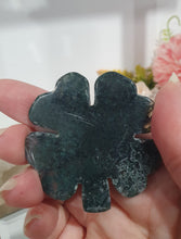 Load image into Gallery viewer, Four Leaf Clover Moss Agate Crystal Carving Stone. Inspires tranquility and grounding.

THIS ITEM IS SCRATCHED AND SCUFFED.
