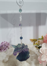 Load image into Gallery viewer, THE MYSTICAL UNICORN" Handcrafted Fluorite Unicorn Crystal Carving Silver Crystal Energy Enhancer© Gemstone / Hanger / Suncatcher / Ornament

PURITY | STRENGTH | MAGIC

Beautiful Fluorite Unicorn Carving Crystal Energy Enhancer© / Sun Catcher / Ornament / Hanger beaded with Fluorite and Quartz.  wired in Silver
