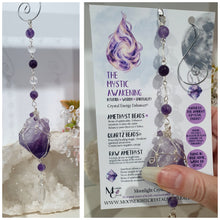 Load image into Gallery viewer, THE MYSTIC AWAKENING" Handcrafted Amethyst Raw Crystal Stone Silver Crystal Energy Enhancer© Hanger Ornament Suncatcher

INSPIRES INTUITION, WISDOM AND SPIRITUALITY

Stunning Raw Amethyst crystal stone beaded with Amethyst and Quartz. Wire wrapped in silver
