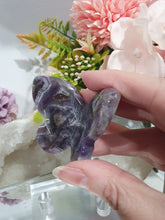 Load image into Gallery viewer, Butterfly Amethyst Crystal Carving Stone on Stand. Inspires Intuition and Spirituality.

Beautiful polished Amethyst Chevron Butterfly Crystal Carving on plastic stand
