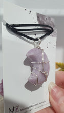 Load image into Gallery viewer, Lepidolite Moon Crystal Pendant Wire Wrapped Silver Stone with black cord chain

STONE OF TRANSITION

Beautiful Lepidolite Moon Crystal Carving Wire Wrapper in Silver non tarnish wire. Accompanied by a black cord necklace
