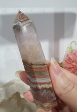 Load image into Gallery viewer, SECONDS STOCK - Amethyst Agate Crystal Point Tower Stone

THIS POINT IS A TAD WOBBLY

INSPIRES INTUITION AND WELLBEING

Amethyst Agate Tower Crystal Stone. is a little wobbly.  


